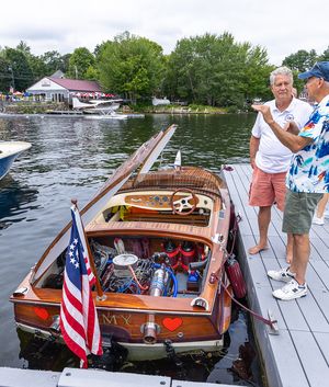Mahogany runabout flying the American flag