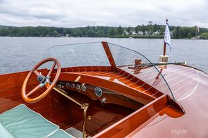 Dashboard and steering wheel of a mahogany runabout