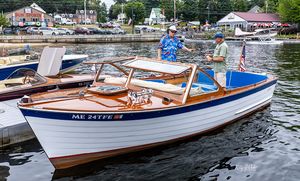 White and blue classic boat at the docks