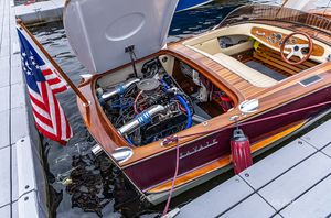 Engine on display in a mahogany runabout