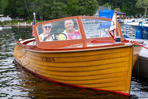Varnished lapstrake boat at the docks