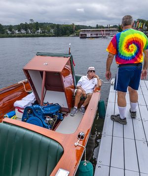 Classic boat and visitors on the dock